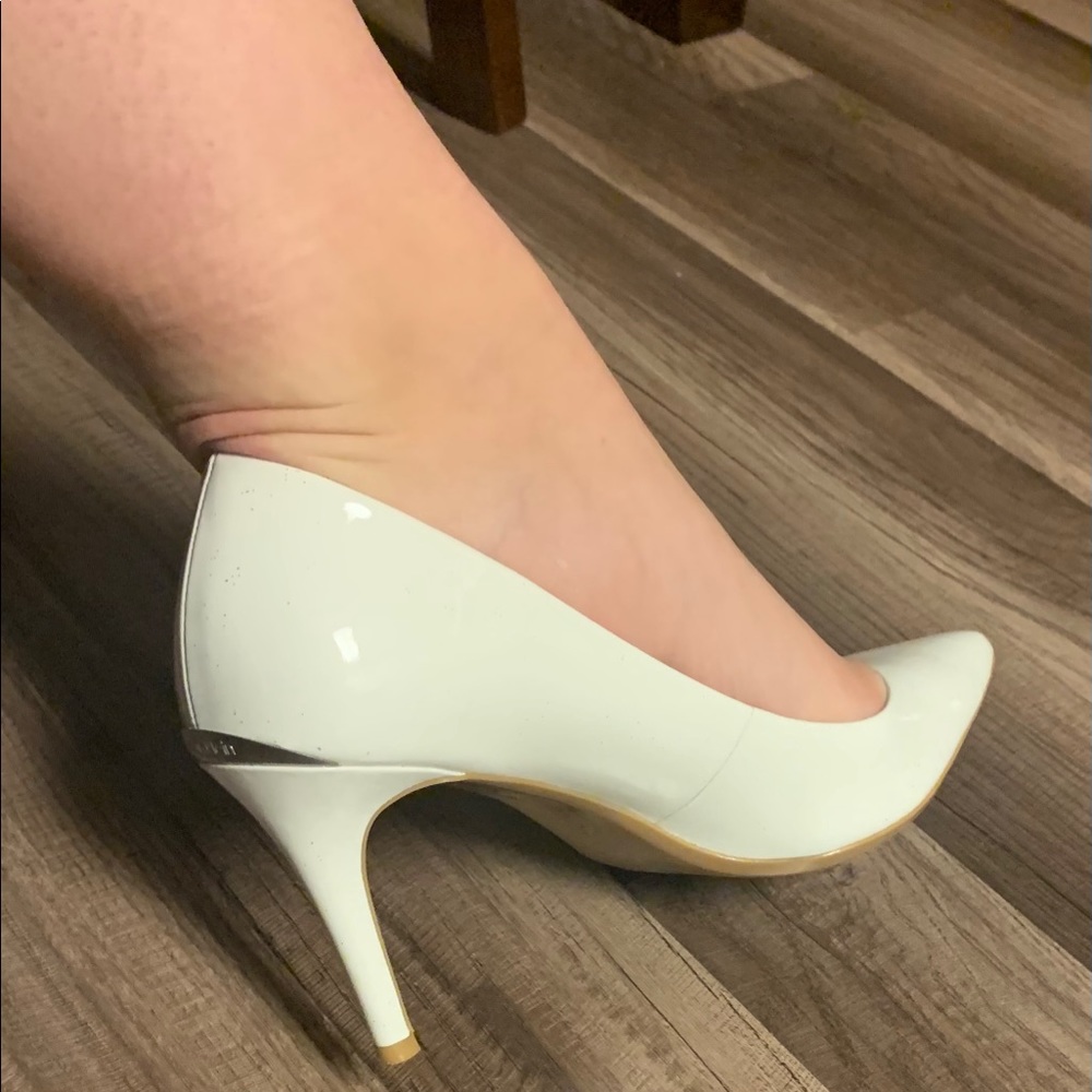 White Calvin Klein pumps